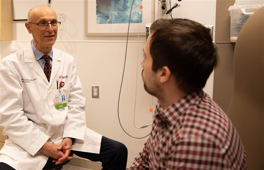 dr g with patient doctor and patient in exam room
