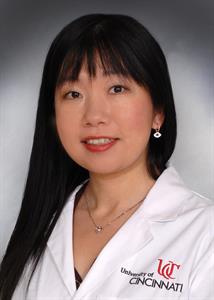 Gao Chen with UC lab coat Photo of Chen Gao